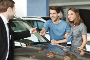Guy handing over rented keys to the couple